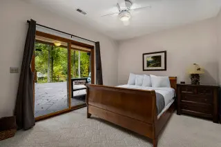 Bedroom with queen bed and sliding glass door, leading to the plunge pool