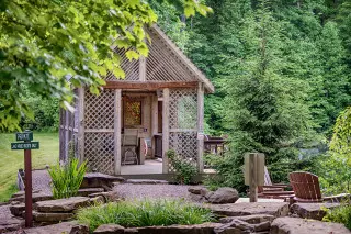 Lakeside gazebo, with firepit, greenery surrounding