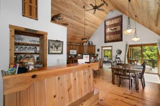 Spacious dining space with high ceilings and dining area
