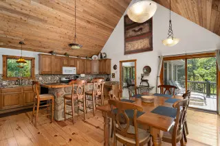 Lake House dining room and kitchen. High ceilings and modern decore