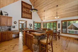 Bar and dining area in spacious cabin. High ceilings and tasteful decore