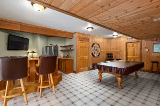 Recreation room with pool table, kitchenette and bar seating