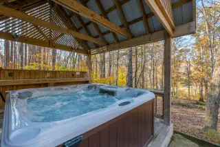 Private hot tub, under a covered gazebo, forest views surrounding
