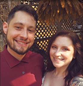 bride and groom smiling at the camera