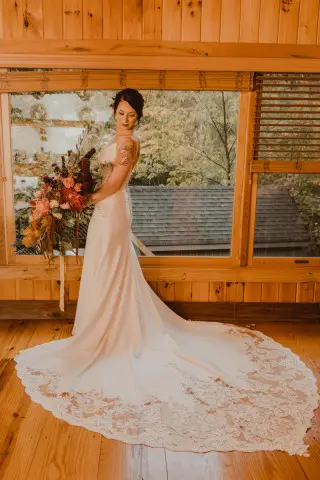Bride posed in front of the picturesque windows