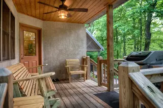 Porch with glider bench and gas grill