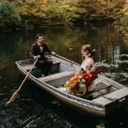 Elopements at Cherry Ridge are unique & memorable. Couple in a rowboat on the water
