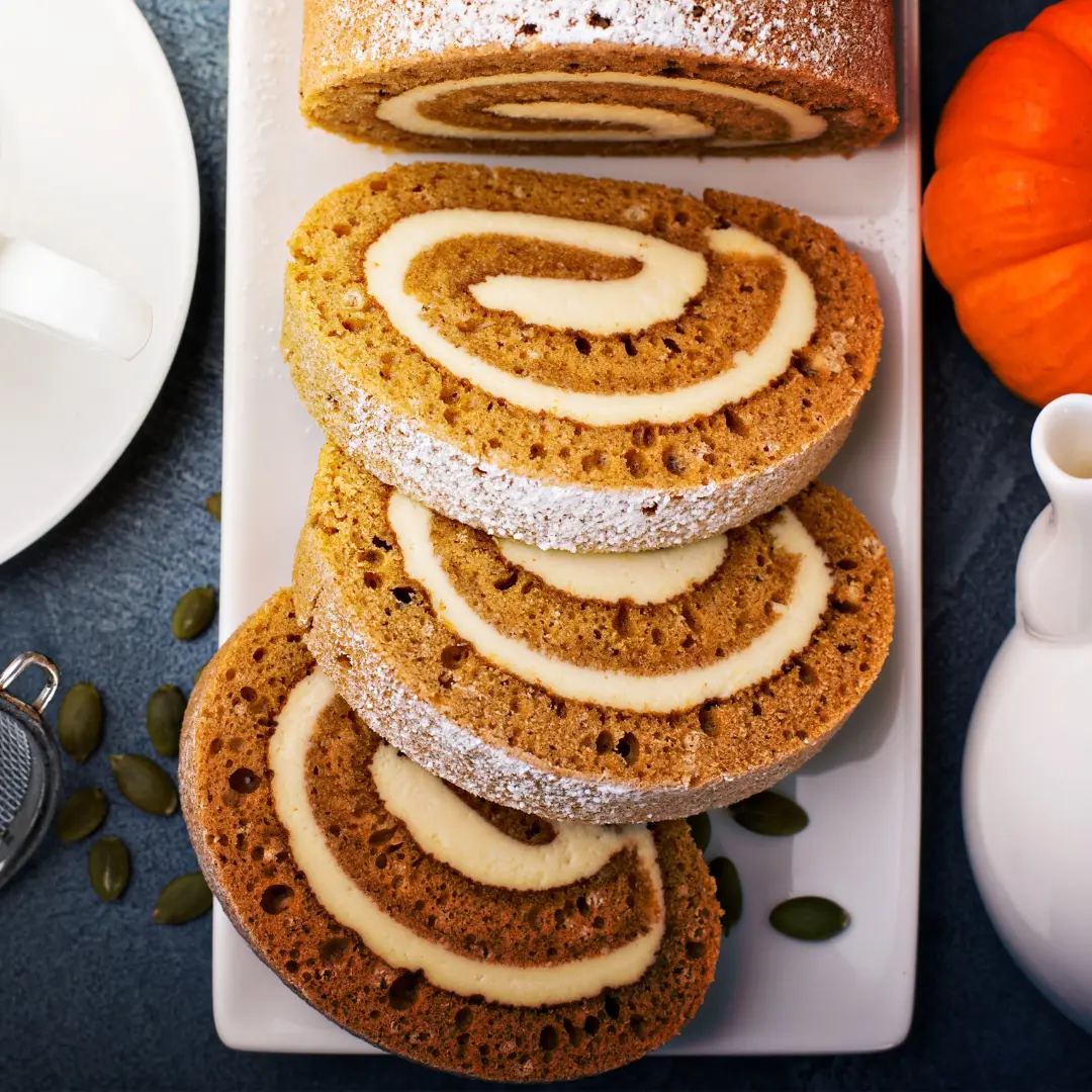 Spiral pumpkin roll, cut into slices on a plate