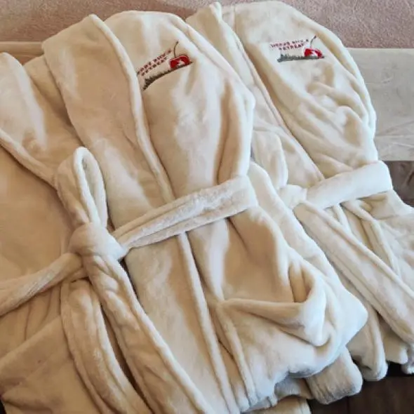 Two robes with Cherry Ridge Retreat logos