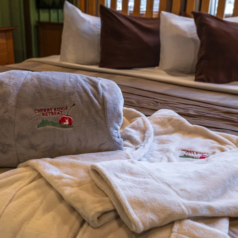 image of white, plush robes with the Cherry Ridge retreat logo