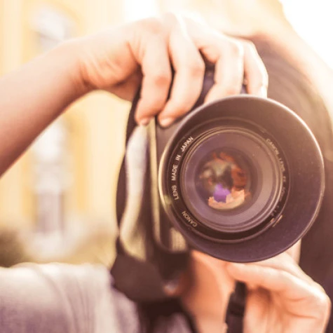 photo of a photographer and camera