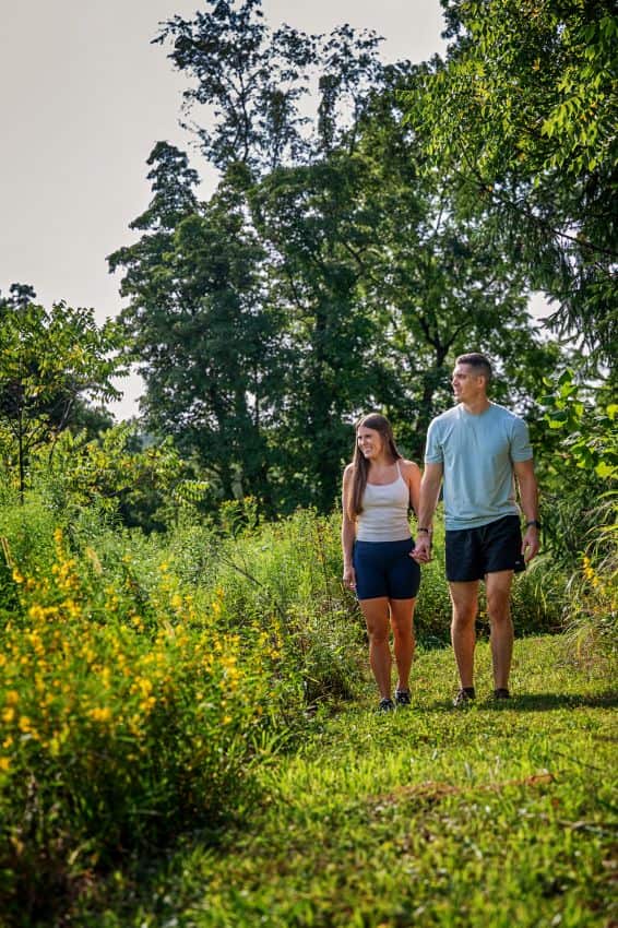 A couple walking on our on property hiking trails