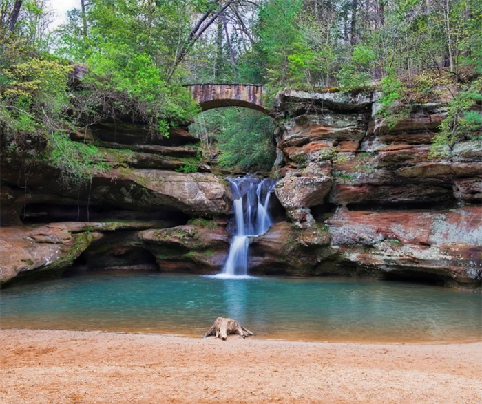 The stunning Upper Falls at Old Man's Cave, just a short drive from your cabin! Waterfall flowing down the rocks at Old Mans Cave