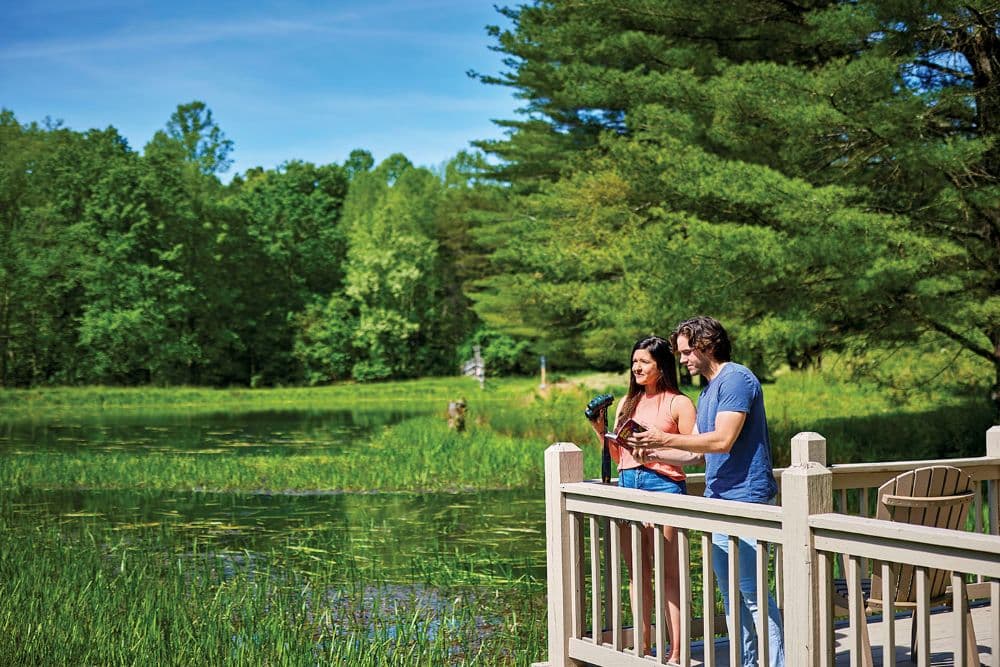 Couple bird watching at one of Cherry Ridge Retreat's fishing docks 