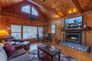 Living room with vaulted ceilings and stunning woodwork. 