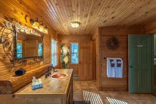 Stunning Boat House bathroom. Wooden interior with high end accents
