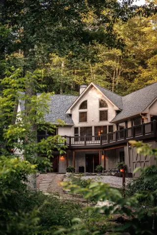 Lake House cabin in the background, greenery surrounding