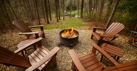 Firepit and Adirondak chairs, forest views from the firepit