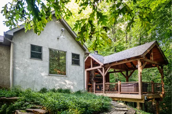 Ravine's Edge outdoor gazebo as viewed through the shrubbery