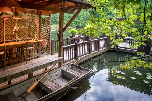 Row boat floating alongside the dock.