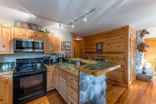 Wooden interior, kitchen with oven and counters