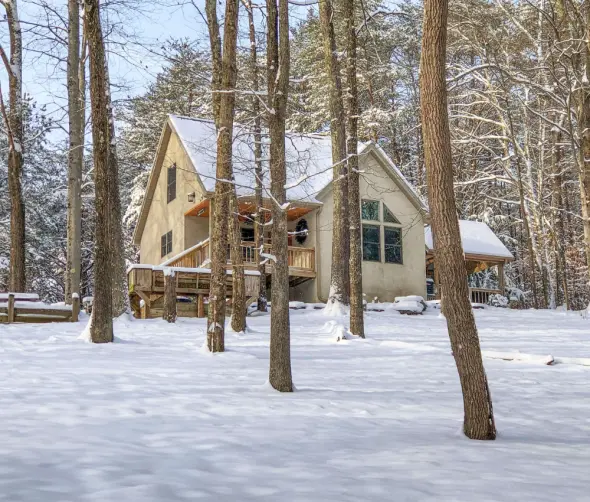 Cabin surrounded by snow 