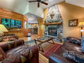 Living room with comfortable seating and coffee table, large window
