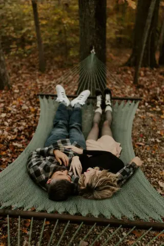 Man and woman laying on hammock