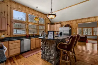 Spacious kitchen with island and bar seating