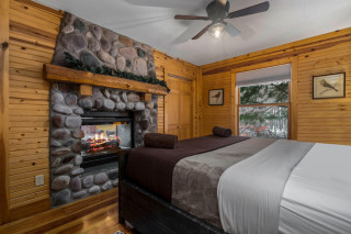 King size bed, with stone fireplace. 