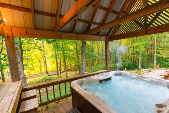 Private hot tub, under a covered gazebo, forest views surrounding