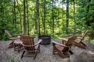 Firepit and Adirondak chairs, forest views from the firepit